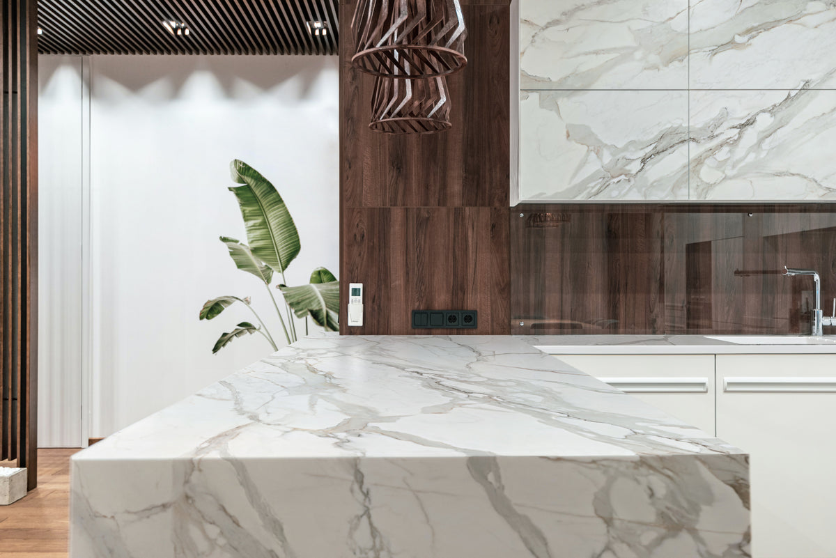 Dekton Morpheus on a kitchen island with a timber-panelled wall