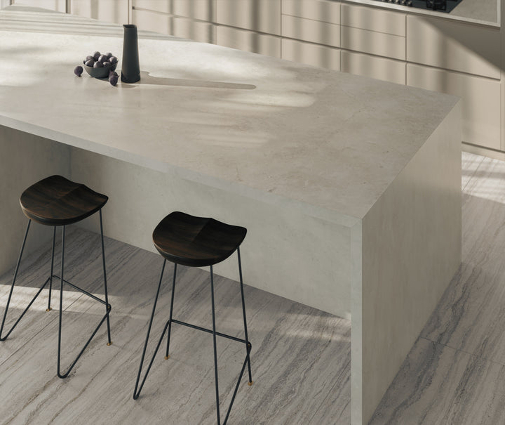 Dekton Sandik in a living room with Dekton Trevi, close-up
