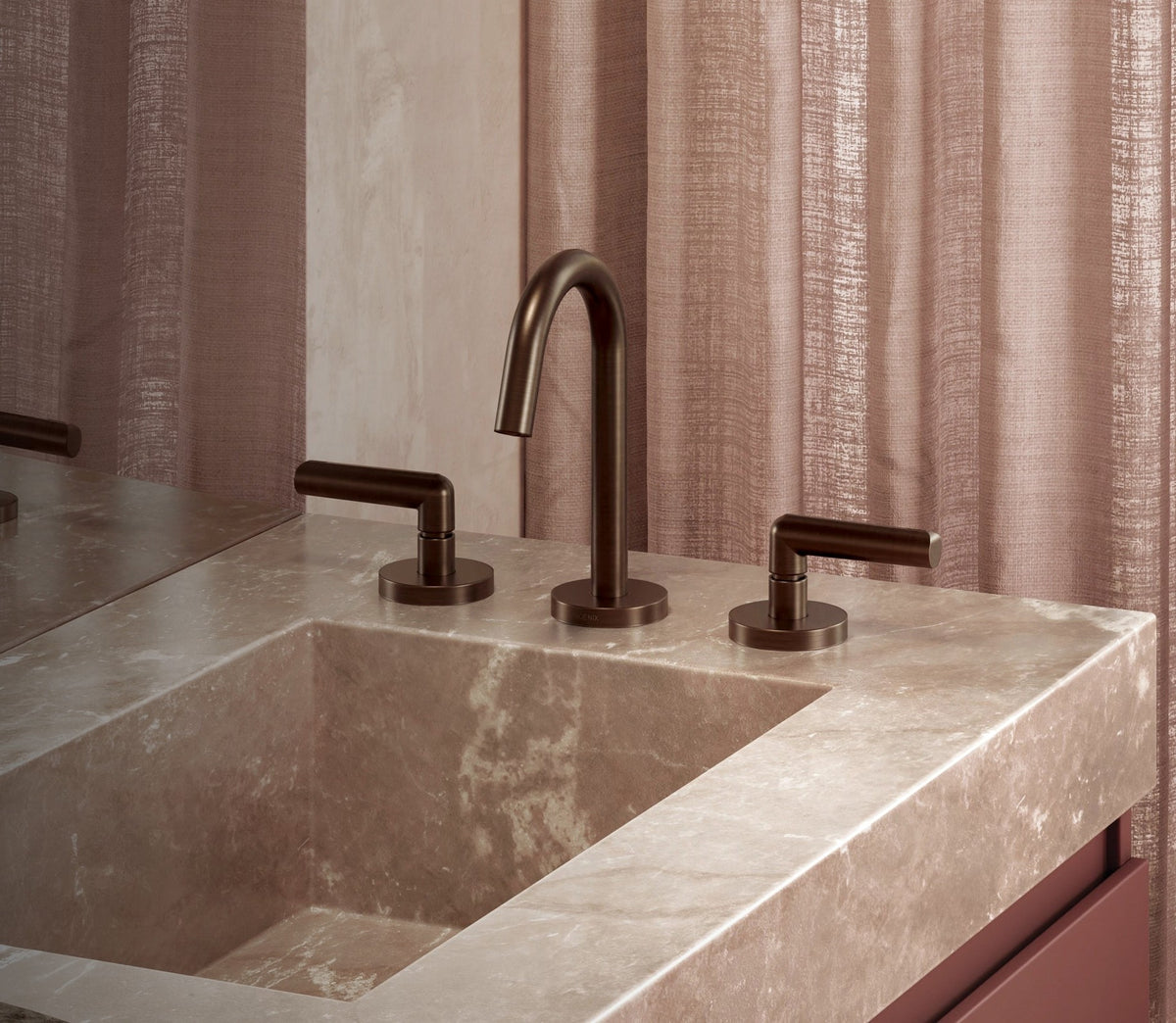 Phoenix Vivid Slimline Plus basin set in brushed bronze on a stone trough basin with mauve linen backdrop