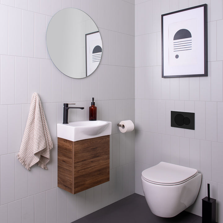 Tiny Semi-Recessed Vanity - Tiny Semi-Recessed Wall Hung. Aged Walnut Chalk textured cabinet finish, White ceramic top