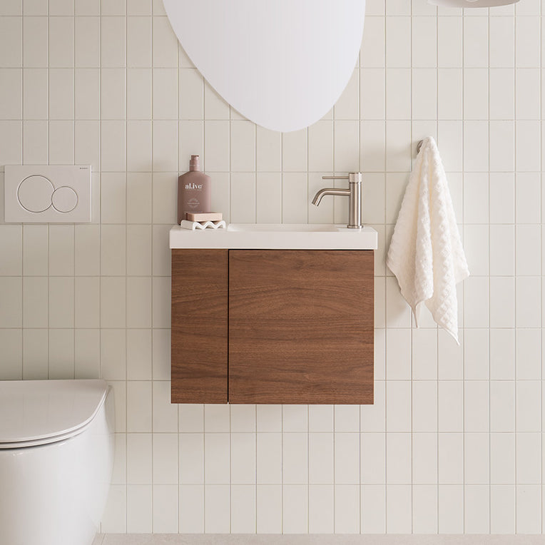 Drift Mini Wall Hung Vanity - Drift Mini Right Hand Offset Bowl. Florentine Walnut textured cabinet finish, Solid Surface Top